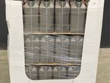 several cans of water are stacked on pallets in a warehouse