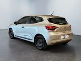 the rear end of a white car parked in a room