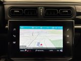 the dashboard of a car with a gps device in the center