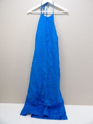 a blue dress hanging on a hanger on a wall