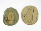 two hats are sitting next to each other on a white surface