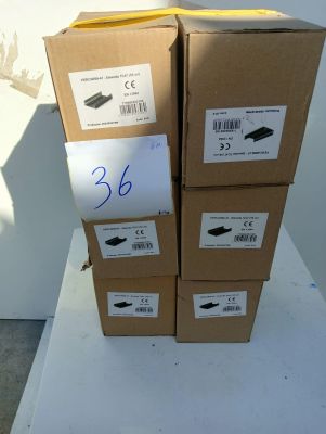 several boxes of shoes are stacked on top of each other on a table
