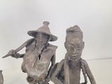 three figurines that are sitting on a table