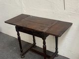 a small table and a small chair in a room