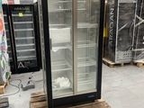 a refrigerator that is sitting on a pallet in a warehouse