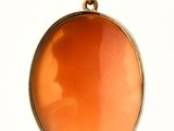 a picture of a pendant with a picture of a woman on it