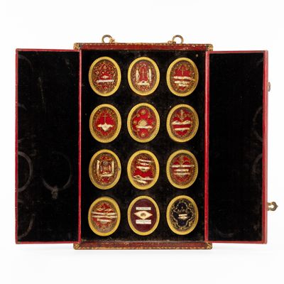 an image of a red case with gold and black buttons