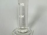 a glass beaker with a measuring scale on it