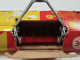 a red and yellow box with a red handle on it