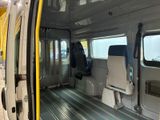 a view of the inside of a bus with its doors open