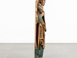 an image of a statue of an angel holding a cross