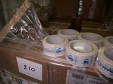 many rolls of tape sitting on top of a box