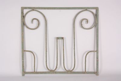 a metal frame with a decorative design on it
