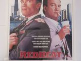 affiche du film « Redheat », représentant deux hommes armés
