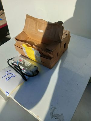 a brown paper bag sitting on top of a table next to a pair of scissors