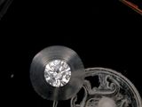 a diamond in the middle of a piece of glass