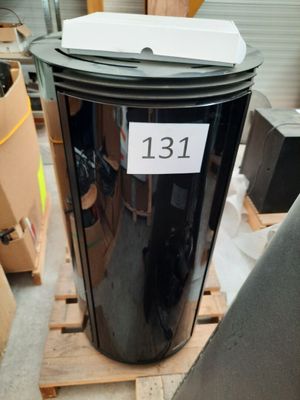 a trash can with a sticker on it sitting on a pallet