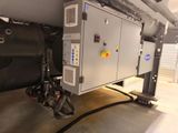 a machine that is sitting on the floor in the garage