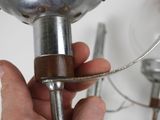 a person that is holding a metal object in their hand