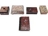 several different types of marble boxes on a white surface