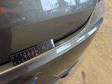 a close up of a car with a ruler on the front of it