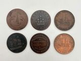 six types de pièces différents sont présentés sur une surface blanche