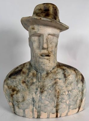 statue of a man with a hat on his head wearing a hat