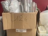 a box full of plastic cups and other items on the counter
