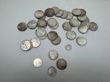 a pile of silver coins sitting on a table