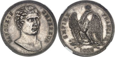 a close up of a coin with an eagle on it