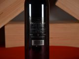 a bottle of wine that is sitting on a table