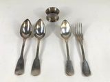 four spoons and two spoons are sitting next to each other