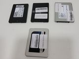 three hard drives sitting on top of a white table next to each other