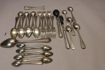 a lot of silver spoons and forks on the table