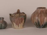 three different types of vases sitting on a table