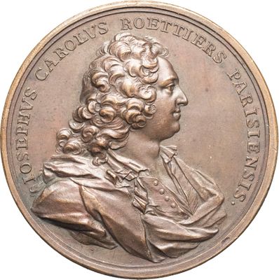 une image représentant une médaille de bronze sur laquelle figure le portrait d'un homme