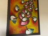 a picture of a painting hanging on the wall above a bed