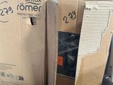 two boxes of computer equipment sitting on top of a table