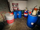 a room with a lot of blue barrels and a red fire hydrant