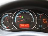 a close up of a car dashboard with a speedometer
