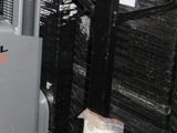 an image of a man working on a machine in a warehouse