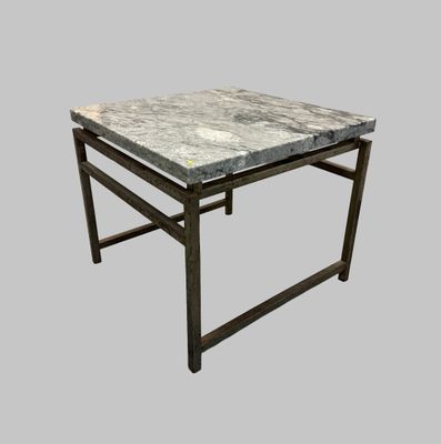 an image of a table with a marble top on a gray background