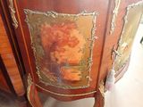 a cabinet that has a painting on the side of it