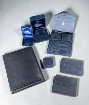 several pieces of leather are arranged on a white surface