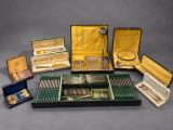 many different types of silverware in a case