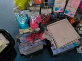 a pile of assorted items on the floor of a store