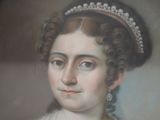 portrait of a woman wearing a tiara and pearl necklace