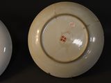 two plates that are sitting side by side on a table