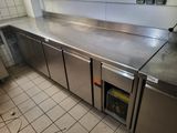 stainless steel counter tops in a commercial kitchen with tile flooring