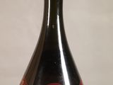 a bottle of wine that is sitting on a table